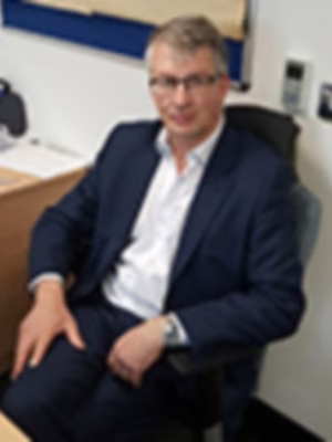 Head shot of Huw Davies